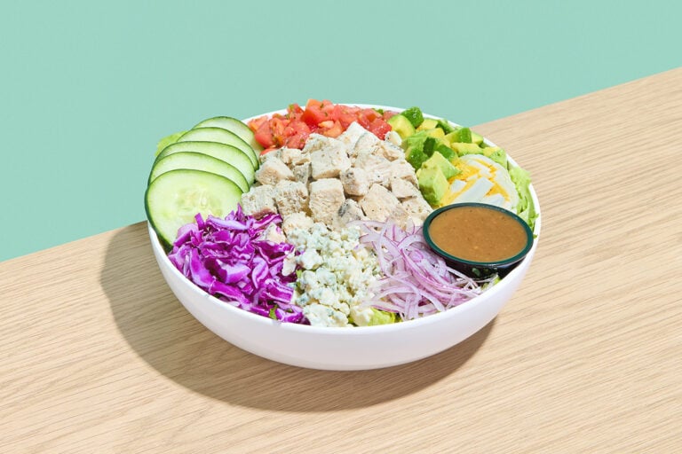 The Cobb salad — Chicken Breast, Romaine, Purple Cabbage, Cucumber, Pico de Gallo, Hard-Boiled Egg, Avocado, Red Onion, Feta Cheese, Balsamic Dressing