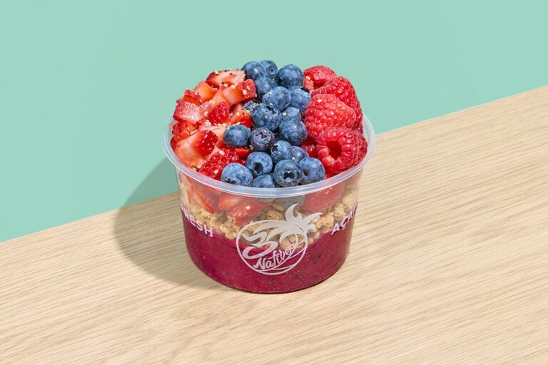 Dragon fruit bowl with granola, blueberries, raspberries, strawberries, chia seeds, and hemp seeds
