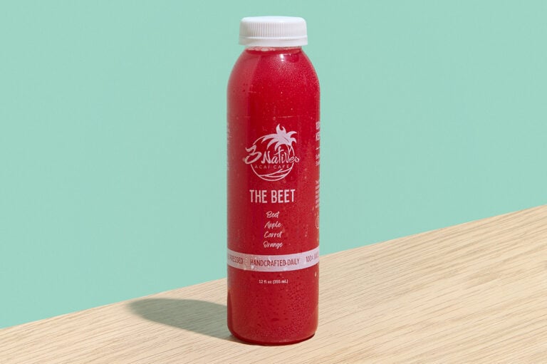 The Beet cold-pressed juice with carrot, apple, orange, and beet in a clear 12 oz bottle.