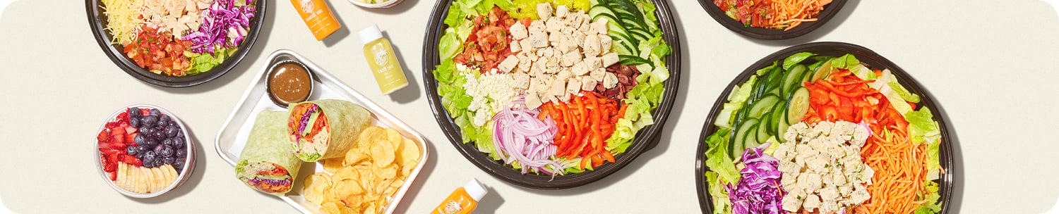 Spread of 3Natives catering salads, bowls, wraps and juices