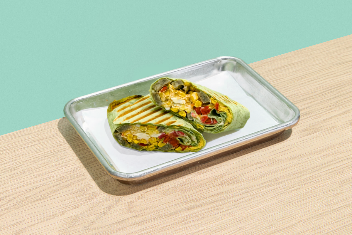 Grilled wrap cut in half on a tray